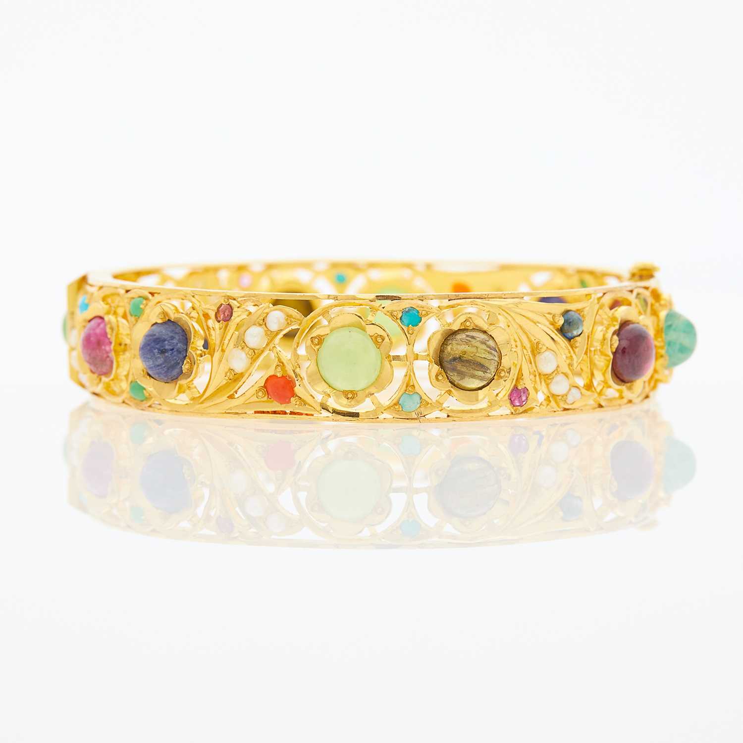 Lot 1053 - Gold, Cabochon Colored Stone and Split Pearl Bangle Bracelet