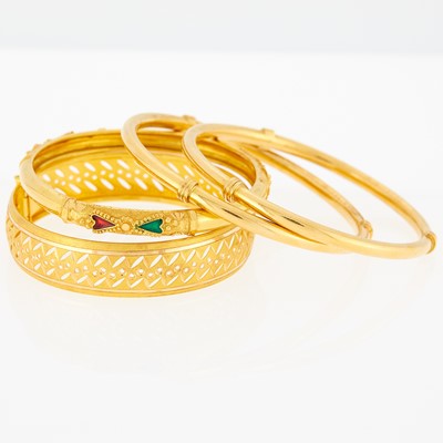Lot 1148 - Four High Karat Gold, Gold and Enamel Bangle Bracelets