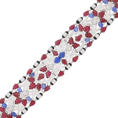 Lot 73 - Wide White Gold, Carved Colored Stone, Diamond and Black Onyx Bracelet