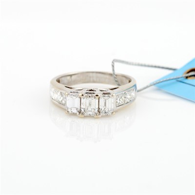 Lot 561 - Diamond Ring, 9 diamonds, 1 stone about 0.65...