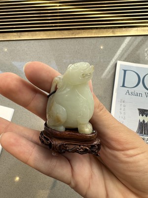 Lot 35 - A Chinese White Jade Carving of a Mystical Beast