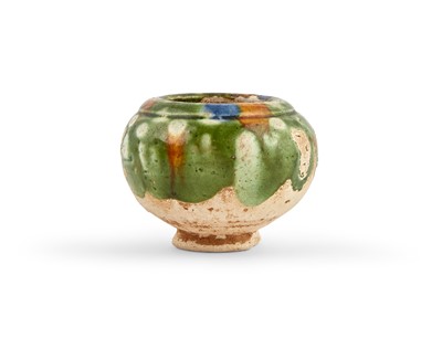 Lot 306 - A Chinese Sancai Glazed Earthenware Jar