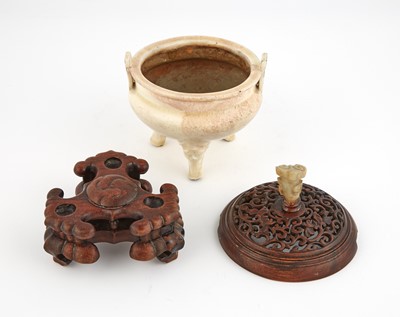 Lot 328 - A Chinese Cream Glazed Tripod Censer