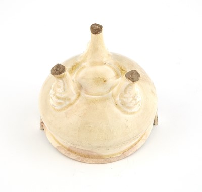 Lot 328 - A Chinese Cream Glazed Tripod Censer