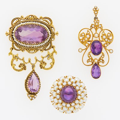 Lot 1178 - Two Gold, Amethyst and Seed Pearl Pendant-Brooches and Cabochon Amethyst and Cultured Pearl Ring