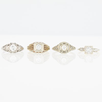 Lot 1174 - Four Yellow and White Gold, Platinum and Diamond Rings