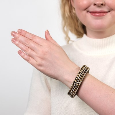 Lot 89 - Pair of Indian Gold, Seed Pearl, Foil-Backed Emerald, Ruby, Diamond and Enamel Bracelets