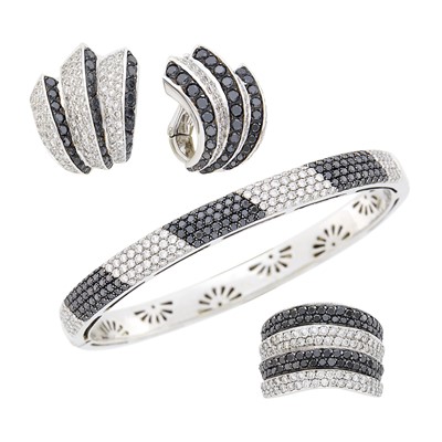 Lot 114 - Two-Color Gold, Diamond and Black Diamond Bangle Bracelet, Pair of Earclips and Wide Ring