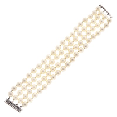 Lot 1073 - Darde & Fils Four Strand Cultured Pearl Bracelet with White Gold and Diamond Clasp, France