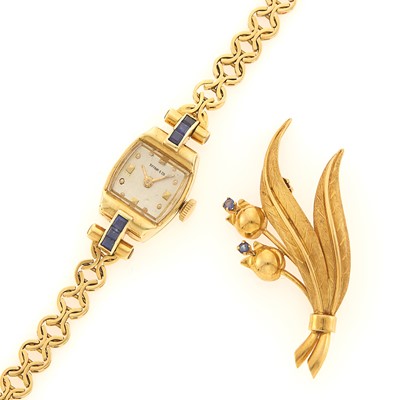 Lot 1206 - Concord Gold and Sapphire Wristwatch, Retailed by Tiffany & Co., and Flower Brooch