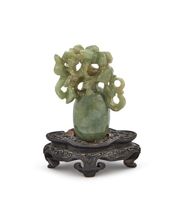 Lot 22 - A Chinese Carved Green Vase with Stand