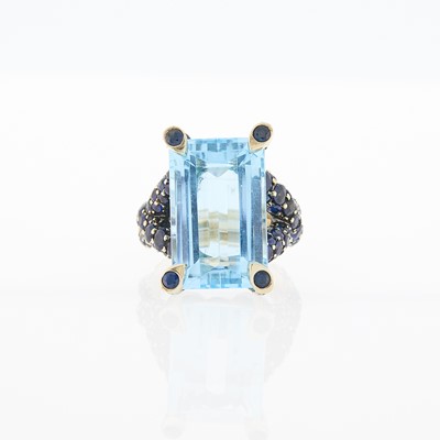 Lot 1216 - White Gold, Blue Topaz and Sapphire Ring