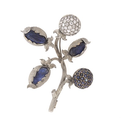 Lot 1099 - White Gold, Carved Sapphire, Sapphire and Diamond Flower Brooch