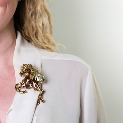 Lot 126 - Gold, Enamel, Emerald and Diamond Horse Clip-Brooch
