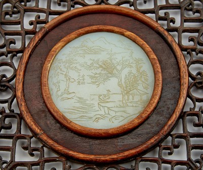 Lot 18 - A Chinese White Jade Disc