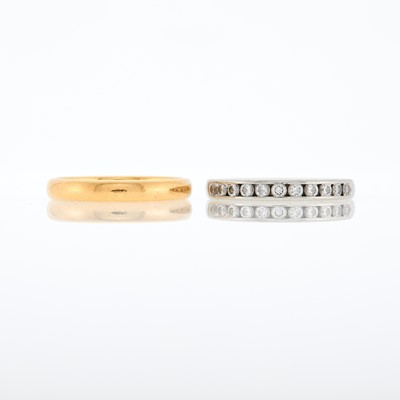 Lot 1229 - Tiffany & Co. Two Gold, Platinum and Diamond Band Rings