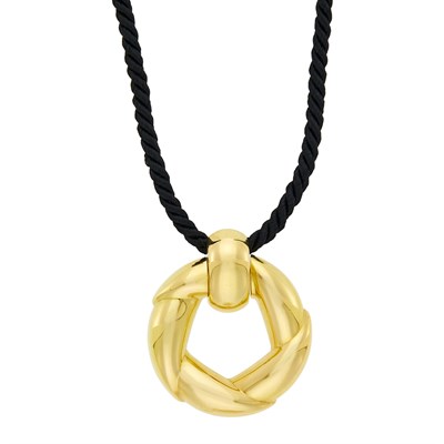 Lot 2020 - Cartier Gold Circle Pendant with Black Cord