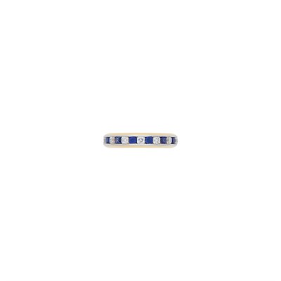 Lot 2143 - Tiffany & Co. Gold, Platinum, Sapphire and Diamond 'Lucida' Band Ring