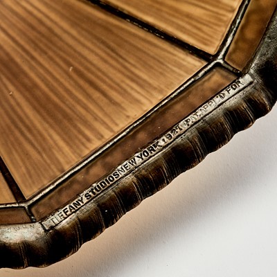Lot 503 - Tiffany Studios Gilt-Bronze and Favrile Glass Linenfold Table Lamp