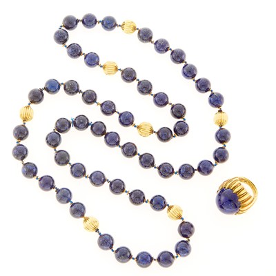 Lot 2093 - Long Lapis and Fluted Gold Bead Necklace and Cabochon Lapis Ring