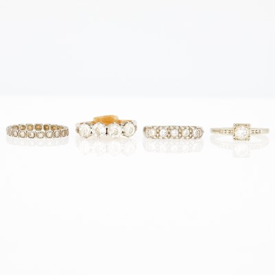 Lot 1208 - Four Platinum, Yellow and White Gold and Diamond Band Rings