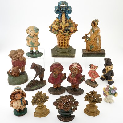 Lot 124 - Group of Fourteen Painted Cast Iron Door Stops of Figures and Flowers
