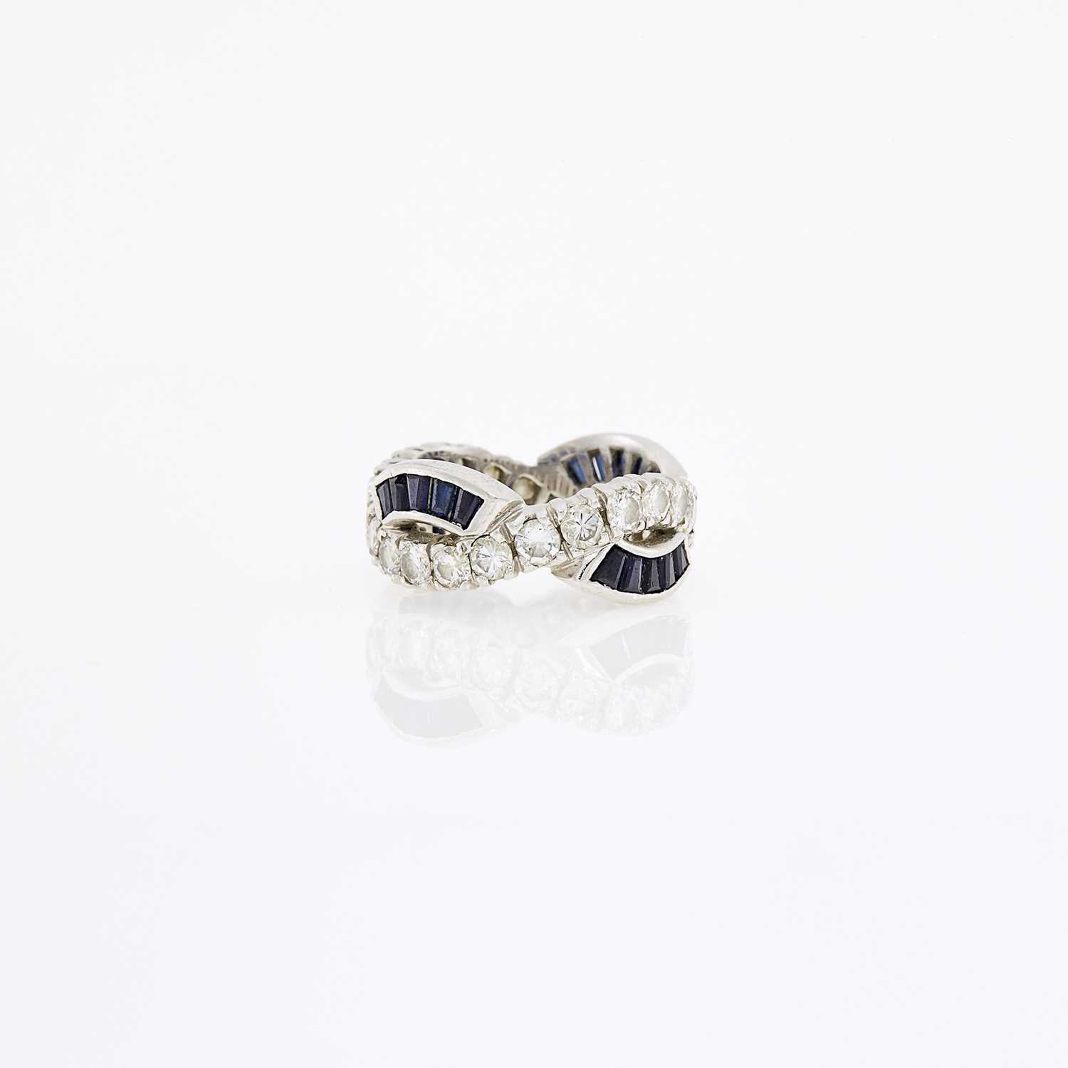 Lot 1075 - Platinum, Diamond and Sapphire Band Ring