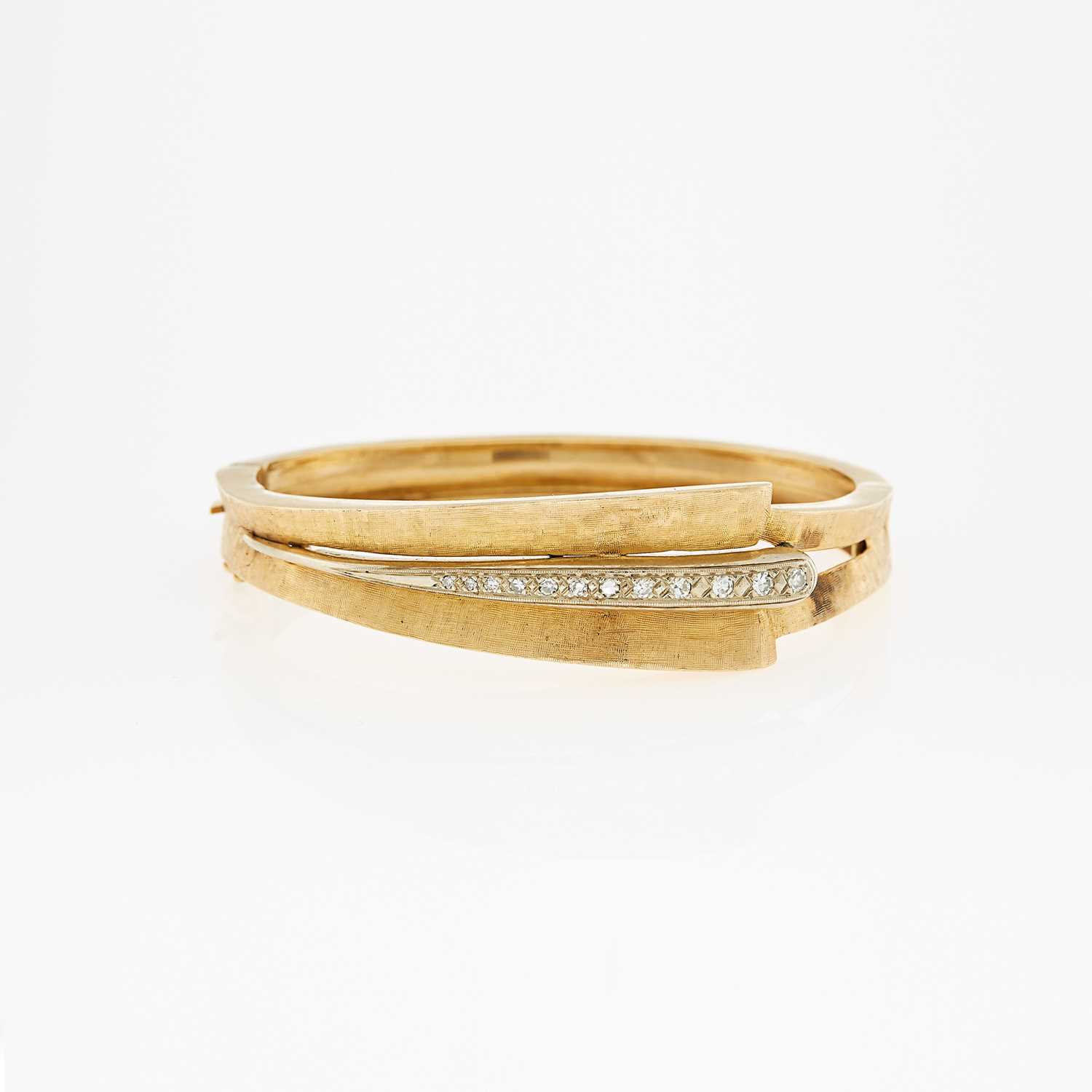 Lot 1100 - Two-Color Gold and Diamond Bangle Bracelet