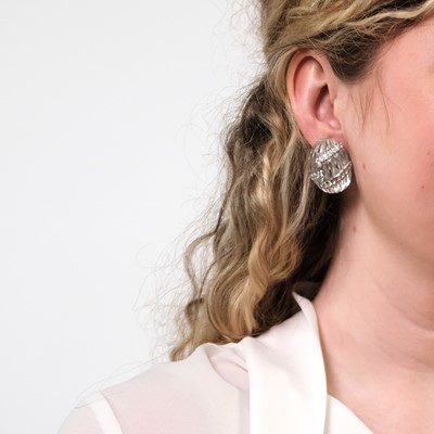 Lot 77 - David Webb Pair of White Gold, Platinum, Carved Rock Crystal and Diamond Bombé Earclips