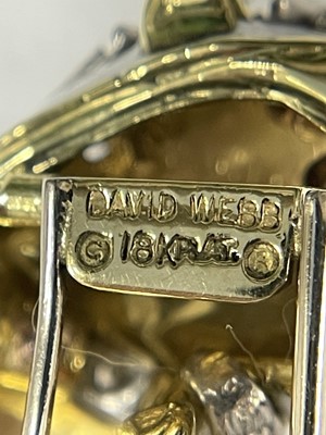 Lot 83 - David Webb Gold, Platinum, White Enamel, Diamond and Emerald Panther Clip-Brooch