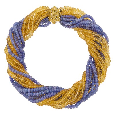 Lot 1117 - Twelve Strand Tanzanite and Citrine Bead Torsade Necklace with Mario Buccellati Two-Color Gold Leaf Clasp