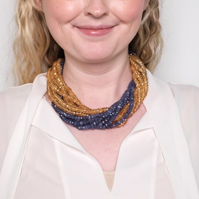 Lot 1117 - Twelve Strand Tanzanite and Citrine Bead Torsade Necklace with Mario Buccellati Two-Color Gold Leaf Clasp