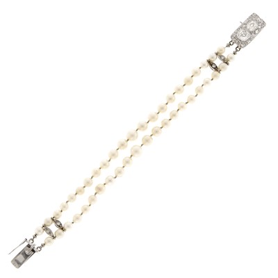 Lot 1090 - Double Strand Platinum, White Gold, Diamond and Cultured Pearl Bracelet
