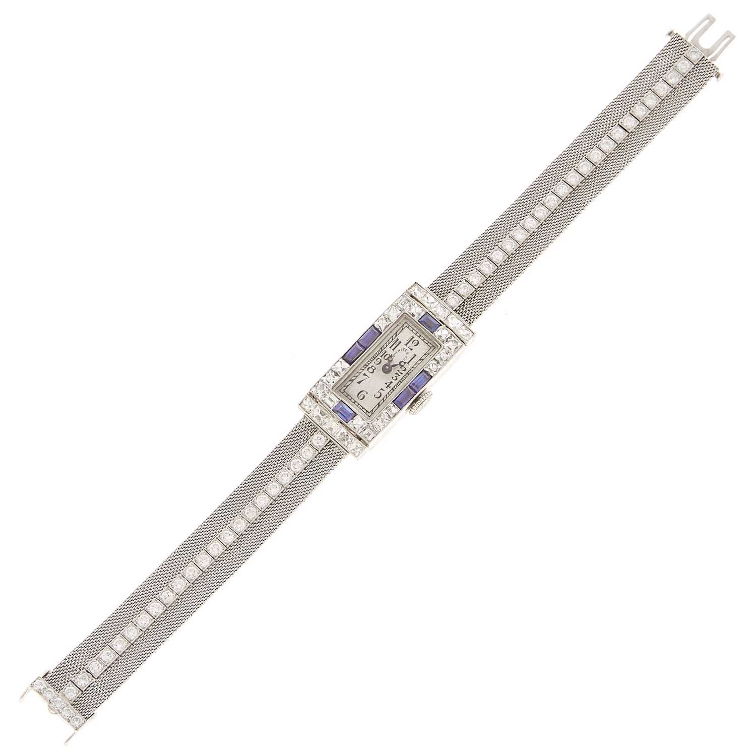 Lot 1045 - Platinum, Diamond and Sapphire Sapphire Bracelet-Watch