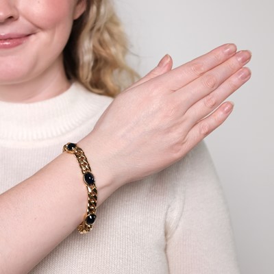 Lot 1150 - Gold and Cabochon Sapphire Curb Link Bracelet