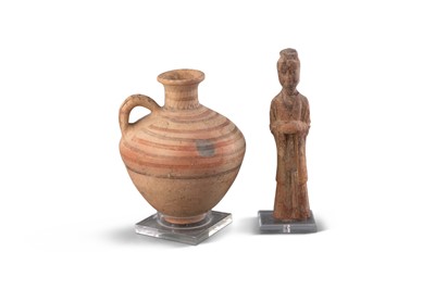 Lot 1087 - A Chinese Unglazed Pottery Figure