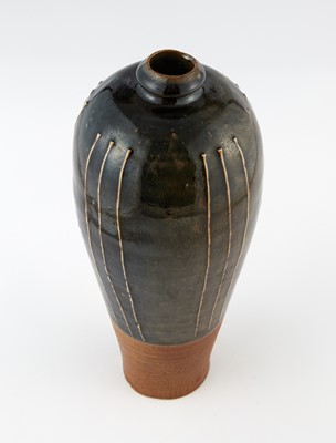 Lot 311 - A Chinese Cizhou Black Glazed Ribbed Vase