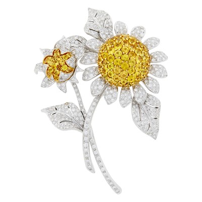 Lot 147 - Two-Color Gold, Diamond and Yellow Sapphire Flower Clip-Brooch