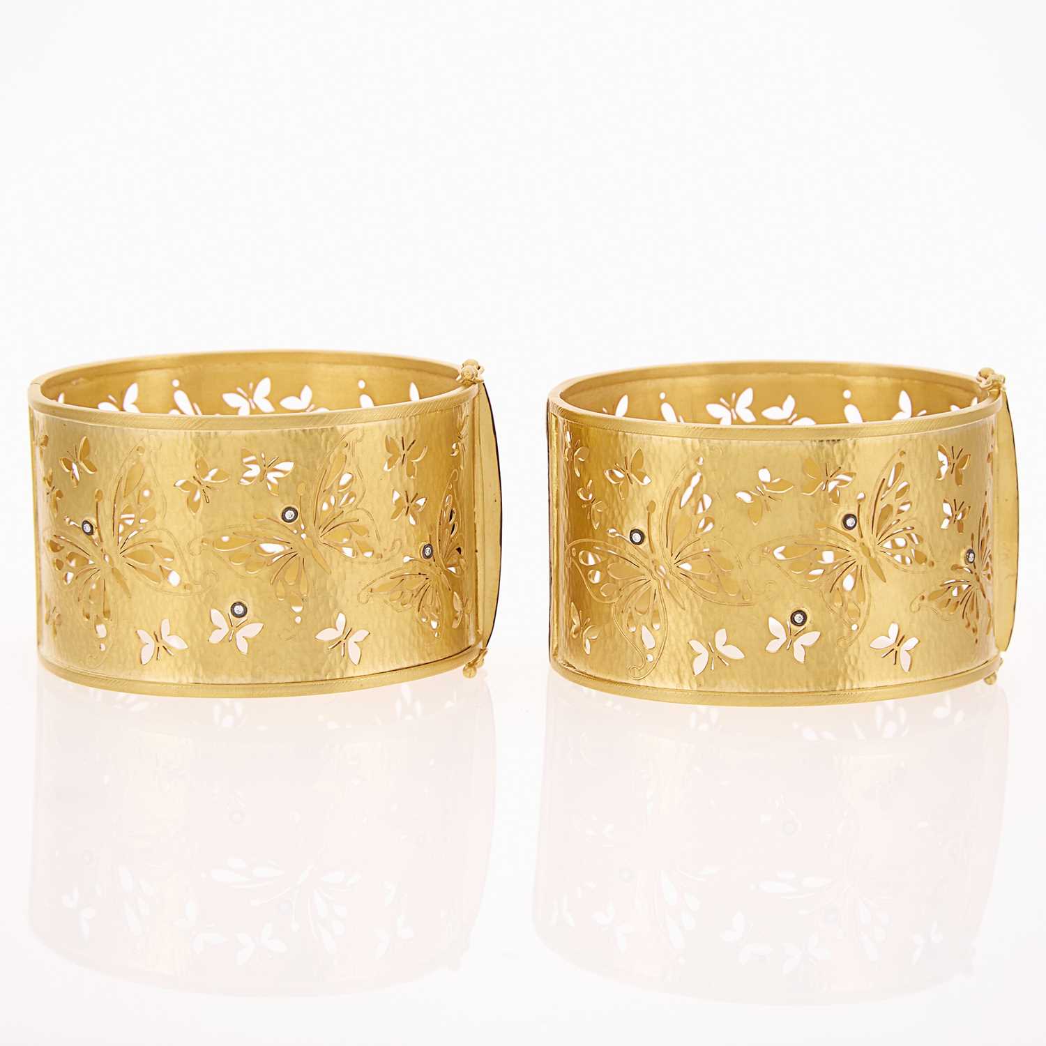 Lot 1189 - Kurtulan Pair of High Karat Wide Gold, Silver and Diamond Cuff Bracelets