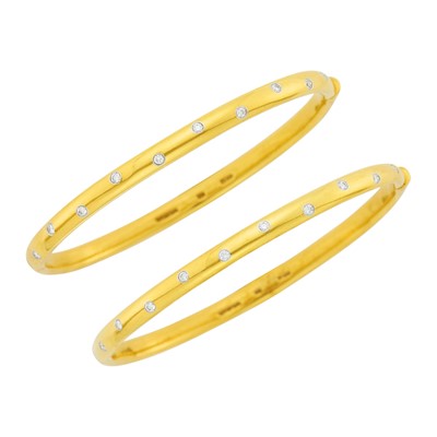 Lot 1008 - Tiffany & Co. Pair of Gold, Platinum and Diamond 'Etoile' Bangle Bracelets