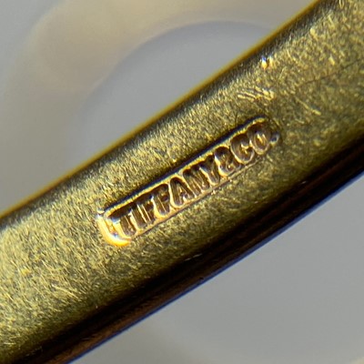Lot 1008 - Tiffany & Co. Pair of Gold, Platinum and Diamond 'Etoile' Bangle Bracelets
