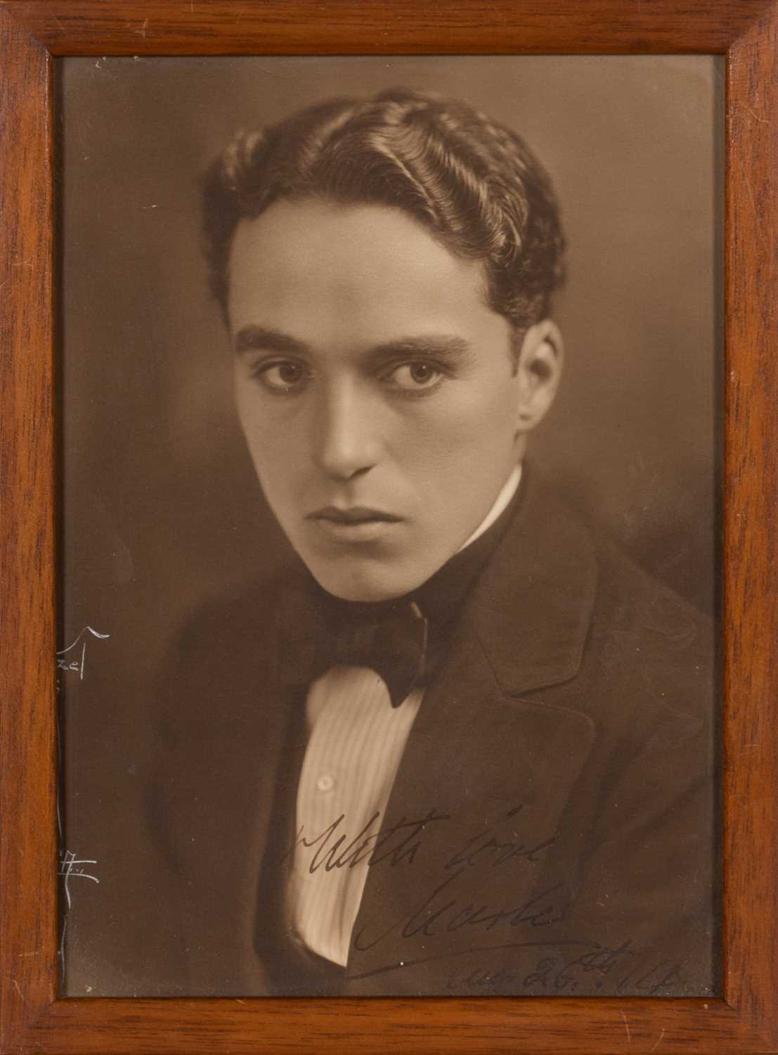 Lot 5050 - An early inscribed photograph of Charlie Chaplin