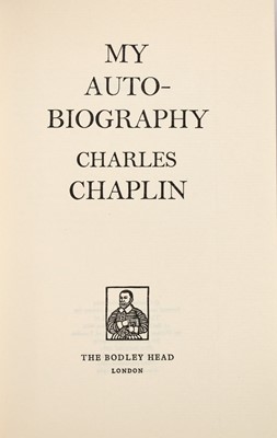 Lot 5053 - Inscribed by Chaplin and with photographs of the star with his wife Oona O'Neill Chaplin