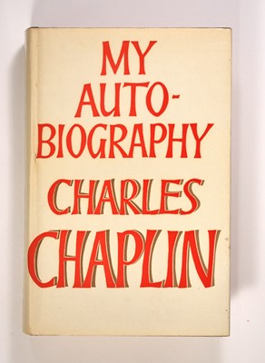 Lot 5053 - Inscribed by Chaplin and with photographs of the star with his wife Oona O'Neill Chaplin