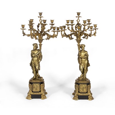 Lot 311 - Pair of Oversize Neoclassical Style Gilt and Patinated Metal Figural Ten-Light Candelabra