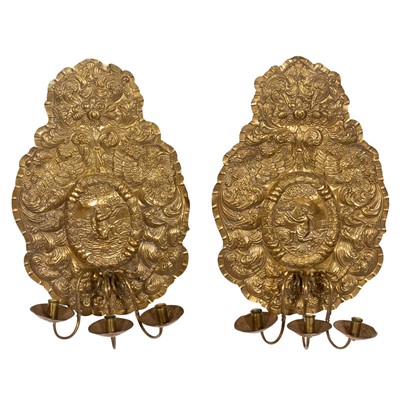 Lot 245 - Pair of Continental Rococo Style Repoussé Brass Three-Light Wall Sconces