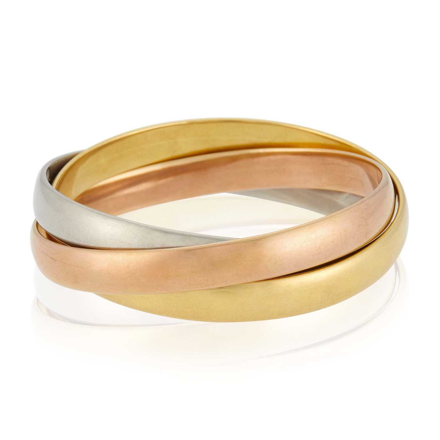 Lot 51 - Cartier Paris Tricolor Gold 'Trinity' Rolling Bangle Bracelet