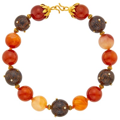 Lot 101 - Gold, Carnelian and Wood Bead and Diamond Necklace