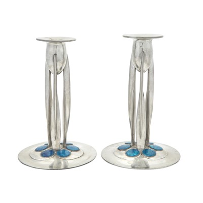 Lot 241 - Pair of Archibald Knox for Liberty & Co. Pewter and Enamel Tudric Pattern Candlesticks