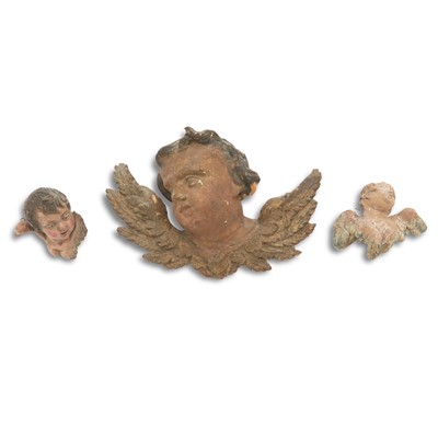 Lot 630 - Three Continental Polychromed   Angel Heads with Wings